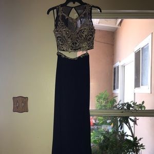 A navy blue prom dress with gold details.